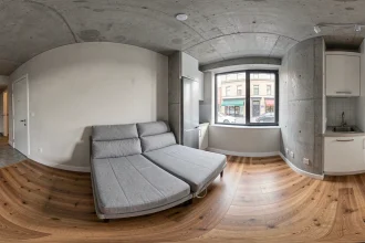 Vue panoramique 360 degrés d'un studio meublé moderne avec parquet bois et cuisine ouverte pour visite virtuelle immobilière